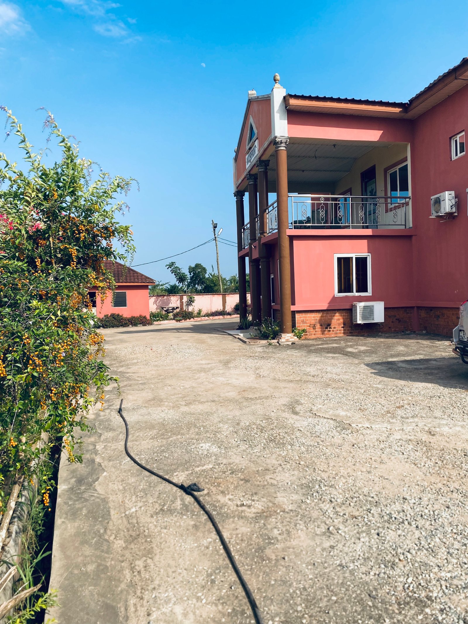 Colourful resort courtyard framed by greenery