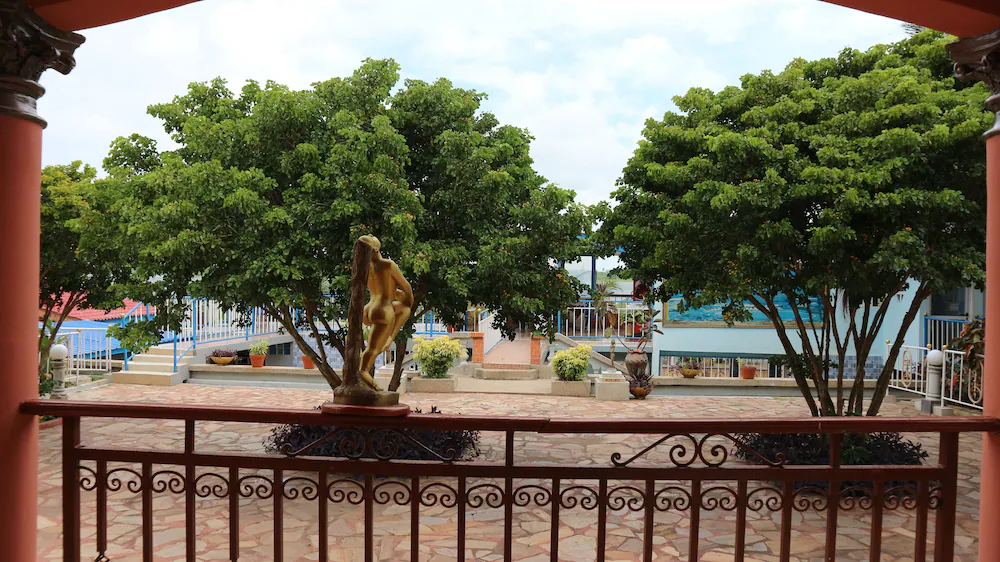 Resort statue framed by two trees